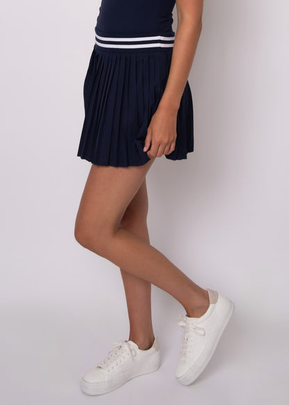 YURA PLEATED SKORT IN NAVY