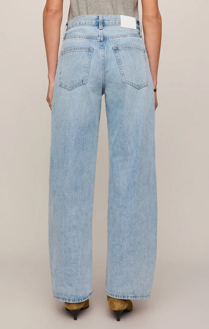 THE SHOW OFF HIGH-RISE BOWED DENIM IN INDIGO BLOOM