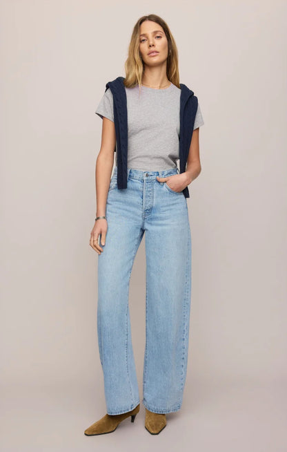 THE SHOW OFF HIGH-RISE BOWED DENIM IN INDIGO BLOOM