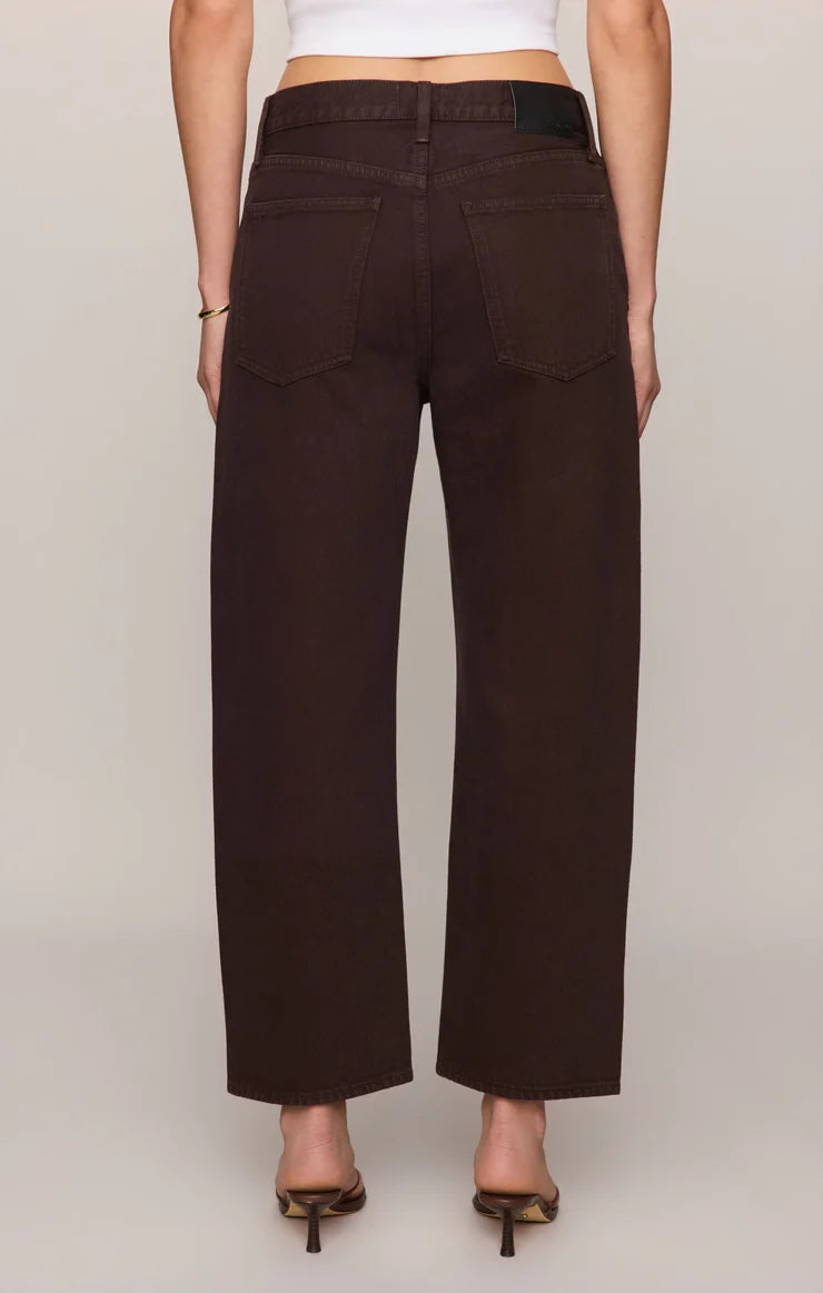 THE OFF DUTY MID-RISE BOWED ANKLE DENIM IN GILDED UMBER