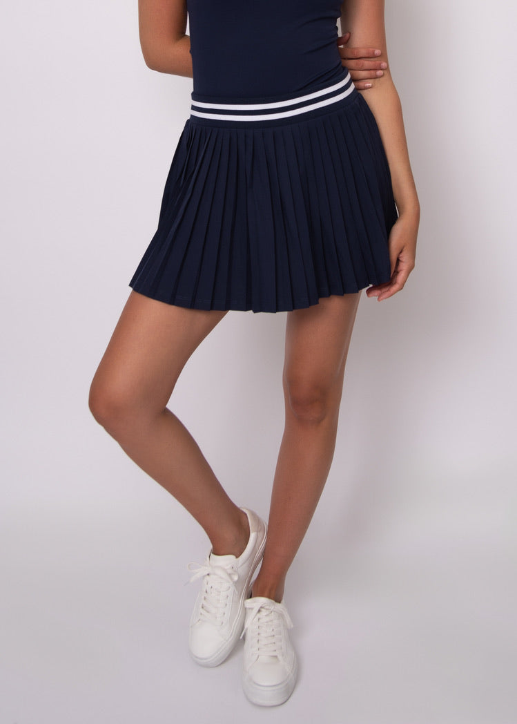 YURA PLEATED SKORT IN NAVY
